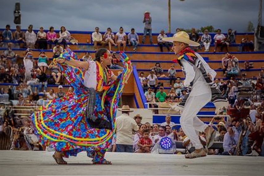 Jarabe mixteco dancers in traditional Mixtec region costume performing at Guelaguetza del Tule festival from Huautla de Jimenez